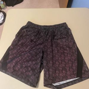 Black FILA shorts with pockets and drawstrings loop, but NO DRAWSTRING